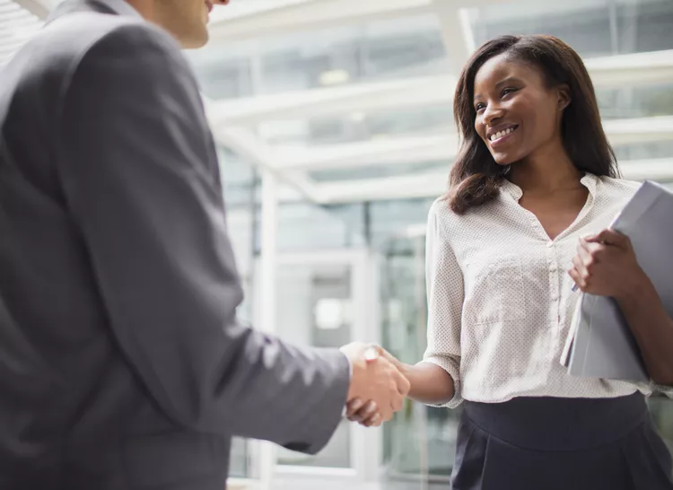 business-people-shaking-hands-outside-of-office-building-521813417-5954fdc33df78cdc2970d5ac - American-Georgian Investments and Real Estate